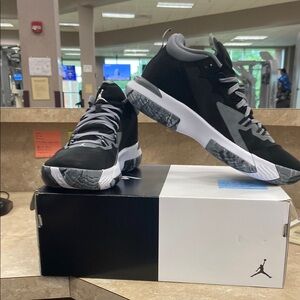 Jordan Black and Gray Athletic Shoes with Mid-Top Design